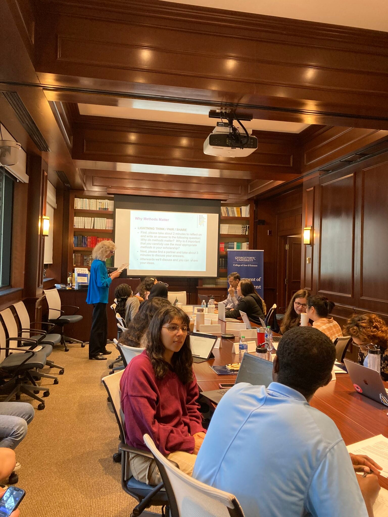 Participants and faculty in a roundtable discussion