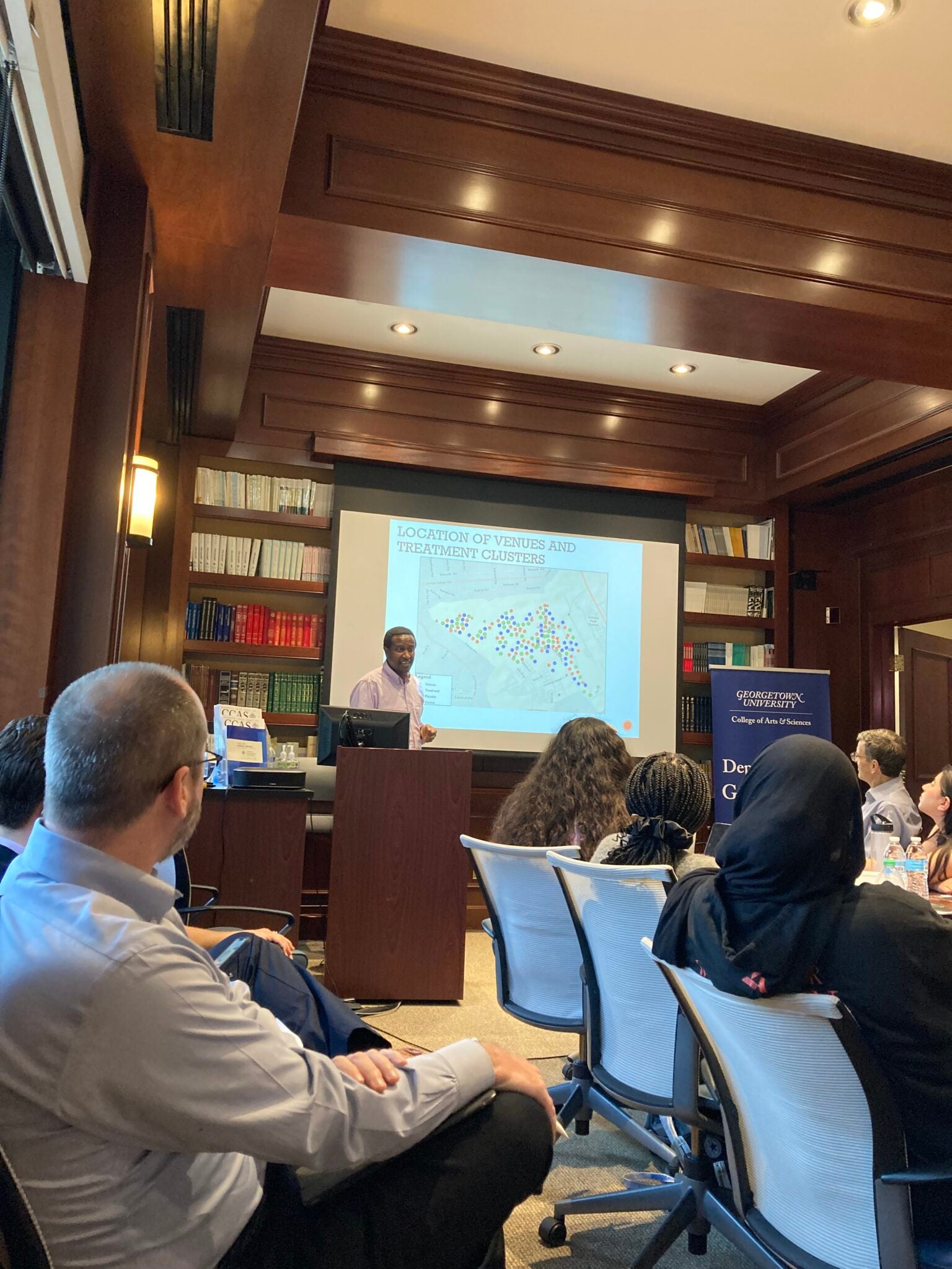 A researcher presents fieldwork during an Institute session